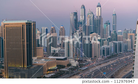 Aerial top view day to night timelapse of Dubai Marina and JLT in Dubai, UAE 112976947