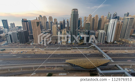 Aerial top view day to night timelapse of Dubai Marina and JLT in Dubai, UAE 112976953