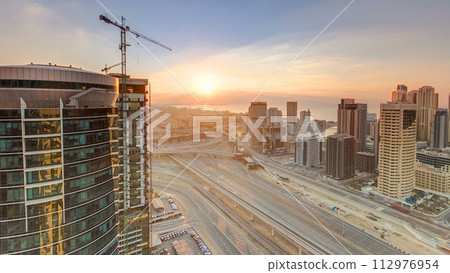 Sunset aerial top view timelapse at Dubai Marina and JLT in Dubai, UAE 112976954