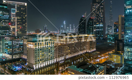 Dubai downtown architecture at night timelapse. Aerial view of numerous skyscrapers near Sheikh Zayed road. 112976965