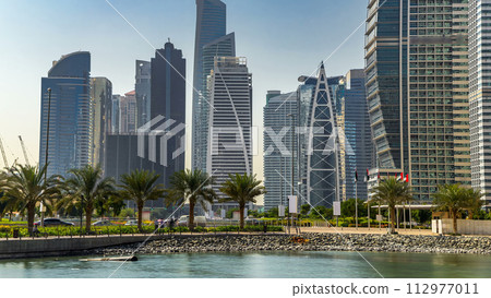 Residential buildings in Jumeirah Lake Towers timelapse in Dubai, UAE. 112977011