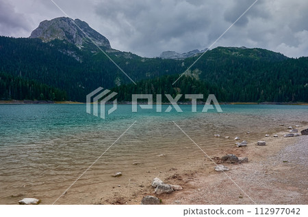 Black lake in Durmitor. Montenegro. Black lake in Durmitor. Montenegro. 112977042