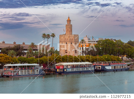 The famous Golden Tower in Seville at sunset. 112977215