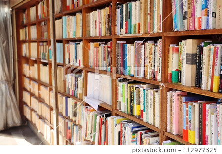 Bookshelves lined up at a store Bookshelves lined up at a store 112977325