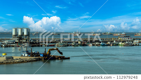 Engineering shipping crane depot at logistic export terminal control. Warehouse freight background container yard loading quayside harbor port. Logistics seascape shipping portal concept Engineering shipping crane depot at logistic export terminal control. Warehouse freight background container yard loading quayside harbor port. Logistics seascape shipping portal concept 112979248