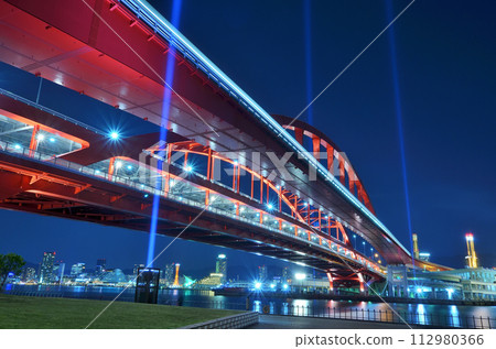 Illuminated Kobe Ohashi Bridge and the light trail of Port Liner Illuminated Kobe Ohashi Bridge and the light trail of Port Liner 112980366
