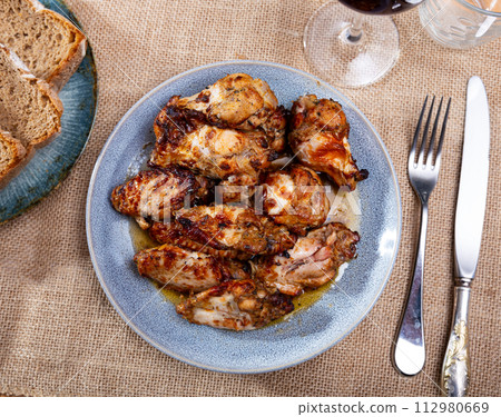 Chicken wings in sauce served on platter Chicken wings in sauce served on platter 112980669