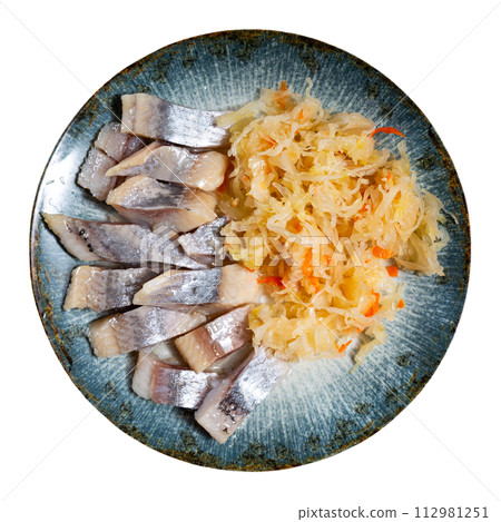 Slices herring fish with pickled cabbage, served on plate Slices herring fish with pickled cabbage, served on plate 112981251
