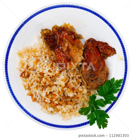 Prepared rice porridge with piece of fried chicken is served on large white platter with bread 112981303