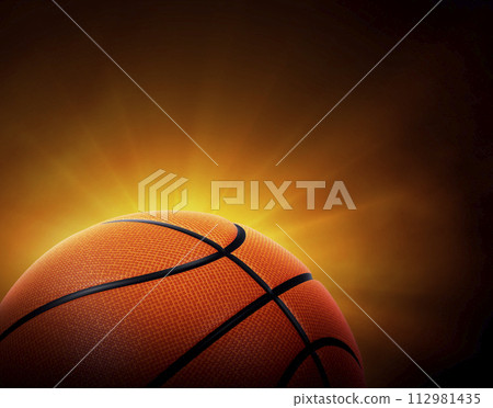 basketball ball. on black background with smoke, yellow orange red white colored back lights 112981435