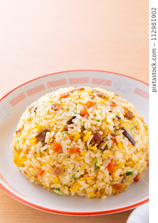 Eating fried rice at a Chinese restaurant Eating fried rice at a Chinese restaurant 112981902