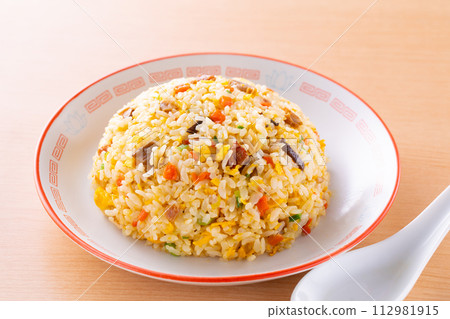 Eating fried rice at a Chinese restaurant Eating fried rice at a Chinese restaurant 112981915