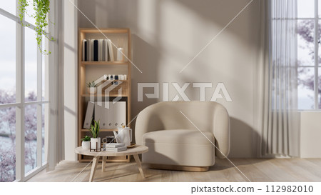 The modern neutral living room interior design with a cozy armchair, a coffee table, and decor. The modern neutral living room interior design with a cozy armchair, a coffee table, and decor. 112982010