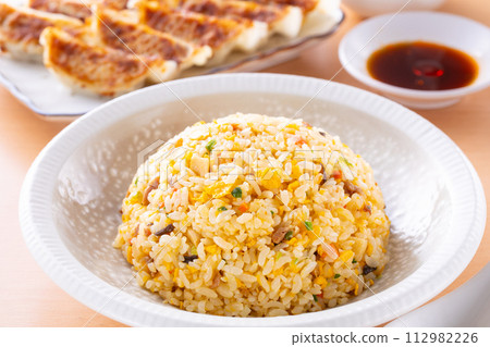 Eating fried rice and fried dumplings at a Chinese restaurant 112982226