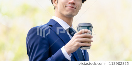 Businessman coffee in hand Businessman coffee in hand 112982825