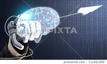 The robotic hand touches the virtual brain with a flying paper airplane 112982899