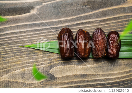 Dried dates fruit for iftar on Ramadan Dried dates fruit for iftar on Ramadan 112982940