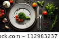 serving cutlery on black top view 112983237