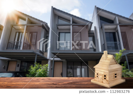 Wooden house on the table Wooden house on the table 112983276