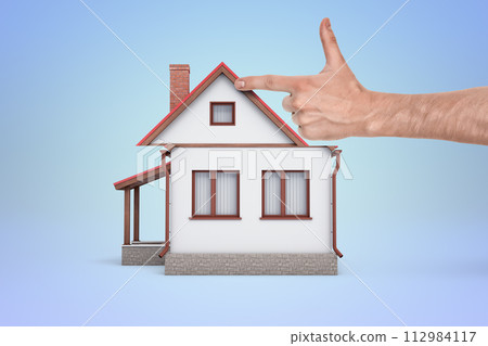 Pointing at a simple depiction of a house 112984117