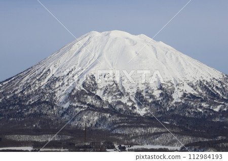 The summit of Mt. Yotei with remaining snow seen from the Niseko Annupuri Ski Resort entrance side The summit of Mt. Yotei with remaining snow seen from the Niseko Annupuri Ski Resort entrance side 112984193