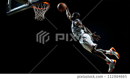 The basketball player is about to perform a slam dunk. generative AI illustration 112984665