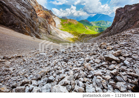 landscape with mountains, clouds and rocks 112984931