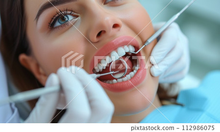 woman at dentist appointment face close up woman at dentist appointment face close up 112986075