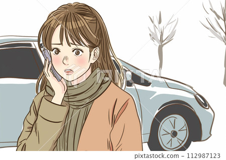 A woman who is in trouble because her car breaks down or has an accident calls by smartphone 112987123