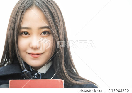 High school girl holding a red book 112988220