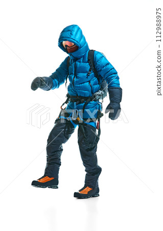 Special equipment for mountaineering activity. Man wearing goggles, ropes, backpack and special boots isolated on white background Special equipment for mountaineering activity. Man wearing goggles, ropes, backpack and special boots isolated on white background 112988975