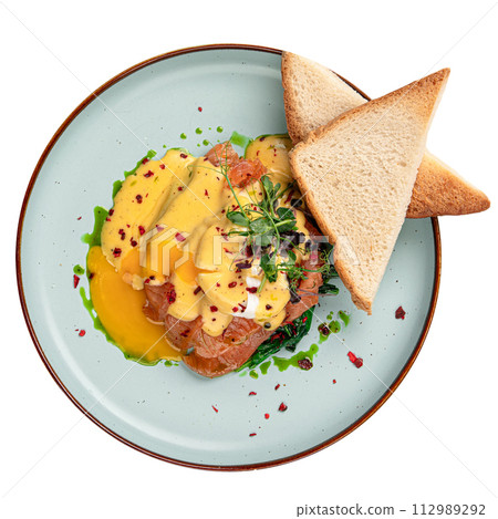 Isolated egg benedict with salmon and toasts Isolated egg benedict with salmon and toasts 112989292