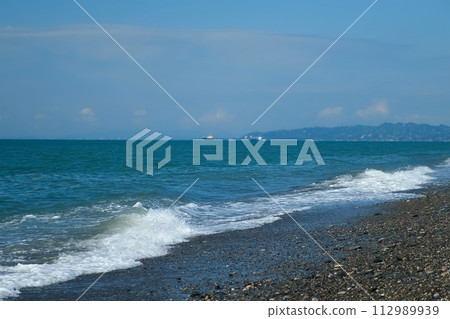 Panoramic nature background with pebble beach, mountains and sea port. 112989939