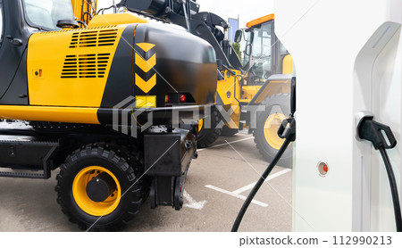 Electric construction machines with charging station. Concept. Electric construction machines with charging station. Concept. 112990213