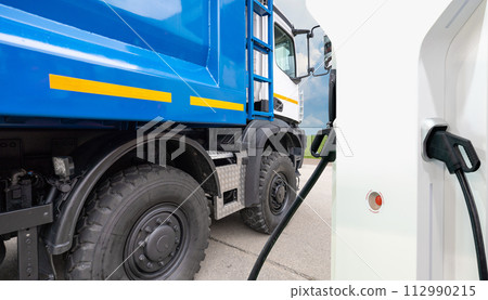 Electric truck batteries are charged from the charging station. Concept.. 112990215