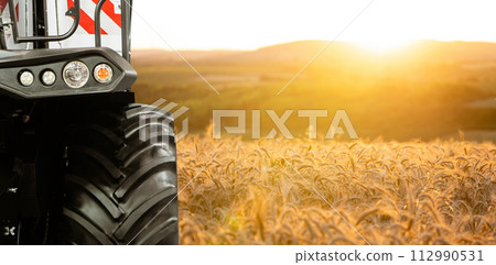 Combine harvester on the wheat field Combine harvester on the wheat field 112990531
