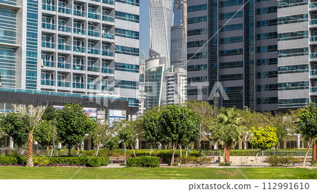 Residential buildings in Jumeirah Lake Towers timelapse in Dubai, UAE. 112991610