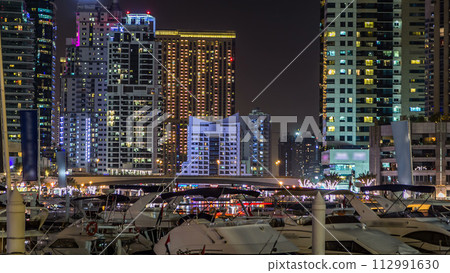 Dubai Marina towers and canal in Dubai night timelapse 112991630
