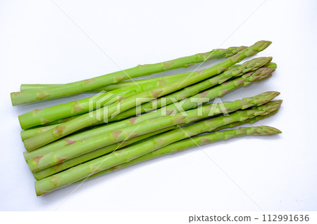 Fresh asparagus photographed on white background 112991636