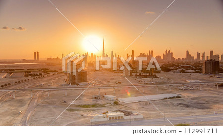 Sunset with skyline of Downtown Dubai in the evening timelapse. Sunset with skyline of Downtown Dubai in the evening timelapse. 112991711