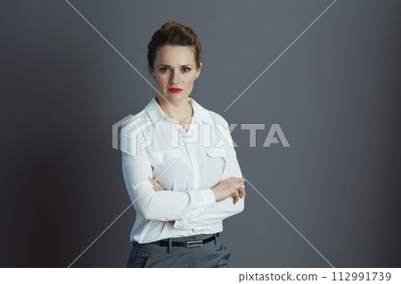 stylish small business owner woman against gray background 112991739