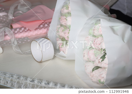 Two marshmallow bouquets. Marshmallow flowers. Marshmallow tulips. Homemade marshmallows. Selective focus. 112991946