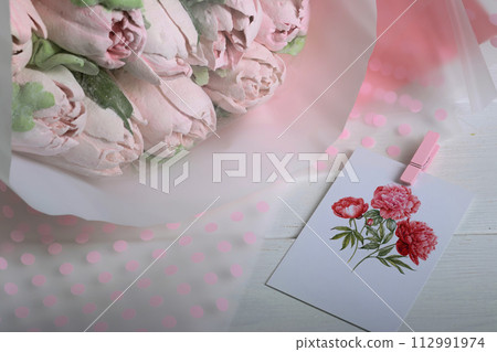 Marshmallow flowers. Bouquet of marshmallows. Marshmallow tulips. Homemade marshmallows. Greeting card with place for text. 112991974
