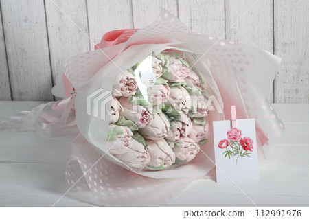 Bouquet of marshmallows. Homemade marshmallows. Marshmallow tulips. Marshmallow flowers. Greeting card with place for text. 112991976
