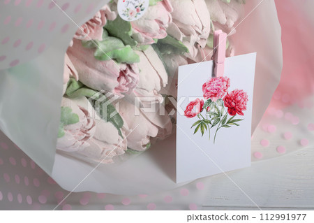 Marshmallow flowers. Bouquet of marshmallows. Marshmallow tulips. Homemade marshmallows. Greeting card with place for text. Close-up. Marshmallow flowers. Bouquet of marshmallows. Marshmallow tulips. Homemade marshmallows. Greeting card with place for text. Close-up. 112991977