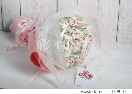 Bouquet of marshmallows. Homemade marshmallows. Marshmallow tulips. Marshmallow flowers. Greeting card with place for text. 112991981