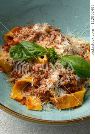 Italian appetizing fettuccine bolognese Italian appetizing fettuccine bolognese 112992495