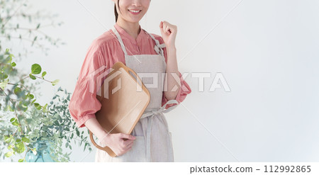 Cafe clerk smiling and fist-pumping Cafe clerk smiling and fist-pumping 112992865