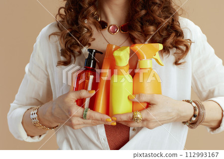 Trendy woman in blouse and shorts isolated on beige Trendy woman in blouse and shorts isolated on beige 112993167