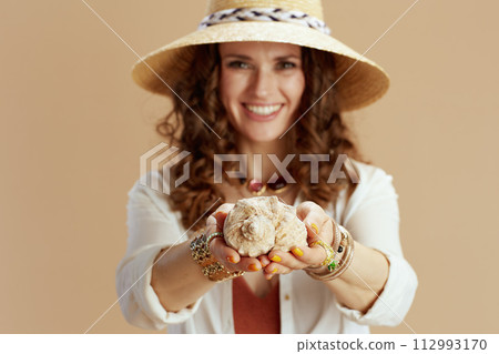 happy trendy woman in blouse and shorts on beige happy trendy woman in blouse and shorts on beige 112993170